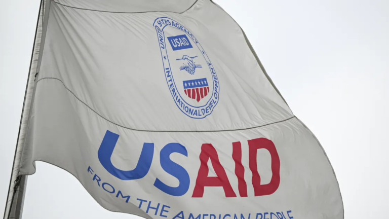 U.S. Foreign Aid Policy: Humanitarian Assistance and Development Goals Date: August 19, 2025 Brief Overview: The Political Significance of U.S. Foreign Aid Policy in 2025 The U.S. foreign aid policy is at a critical juncture amid sweeping budgetary cuts and structural overhauls affecting humanitarian and development assistance. This policy shift reflects broader political tensions over spending priorities, U.S. global leadership, and the strategic use of aid as a tool of diplomacy and national security. Ongoing debates highlight the conflict between sustaining critical humanitarian support abroad and domestic political pressures to reduce foreign expenditure. Key Facts & Figures on U.S. Foreign Aid and Humanitarian Assistance Budget and Funding Trends The Biden administration’s FY2025 budget requested $64.4 billion for foreign assistance, down from $70.5 billion requested for FY2024. Approximately $58.8 billion is allocated to the Department of State and USAID, the primary agencies administering aid. Humanitarian and refugee assistance funding totals $10.3 billion, alongside $3 billion earmarked for democracy and governance promotion. The Global Fund’s U.S. contribution cuts from $2 billion in FY2024 to $1.2 billion in FY2025 due to statutory limits on funding. Trump's administration has enacted policies to consolidate USAID's functions under the State Department, aiming to reduce staff from thousands to a few hundred by mid-2025. Programmatic and Legal Developments A January 2024 executive order paused foreign aid disbursement indefinitely, pending alignment with U.S. foreign policy. A U.S. court ruling in August 2025 allowed withholding billions in aid, including $4 billion for global health and $6 billion for HIV/AIDS programs, fueling legal and operational uncertainty. The Trump-era administration is realigning USAID’s humanitarian functions into the State Department, raising concerns about the agency’s future role and capacity. Humanitarian Impact U.S. contributions accounted for approximately 41.8% of global humanitarian financing in 2024 (~$14 billion). Aid program suspensions risk massive disruptions for crisis-affected populations and non-governmental implementing partners worldwide, affecting tens of thousands of jobs and humanitarian operations. Waivers for "life-saving" aid have allowed some continuation, but payment delays and administrative hurdles are widespread. Background and Political Context of U.S. Foreign Aid Policy U.S. foreign aid has long been an instrument of diplomacy, development, and national security since the Cold War. The foundational statute, the Foreign Assistance Act of 1961, created USAID and formalized economic and humanitarian assistance programs distinct from military aid. Over the decades, the policy evolved, embracing global health, democracy promotion, and economic development priorities. However, recurring efforts to reform U.S. aid architecture—spanning Nixon’s Peterson Commission (1970) to the New Directions law (1973)—reflect ongoing challenges in coherence and strategic focus. Recent decades saw bipartisan support for large-scale global health initiatives such as PEPFAR and humanitarian responses to crises like COVID-19. Yet political debates intensified over aid’s size, efficacy, and diplomatic aims, especially in the Trump administration, which applied "carrot and stick" diplomacy, suspending aid to certain countries based on political criteria, thereby politicizing assistance and raising sustainability concerns. The Biden administration's recent budget cuts and restructuring build upon and extend these dynamics, adjusting to domestic fiscal constraints and foreign policy realignment. Main Actors and Stakeholders in U.S. Foreign Aid Policy U.S. President and Executive Branch: Sets foreign aid priorities, executes budget proposals, and directs agencies like USAID and the State Department. The Biden administration seeks to balance aid cuts with strategic influence; the Trump administration pushed for restructuring and aid terminations. Congress: Holds appropriation powers and legislative oversight; deeply divided between those advocating for significant aid cuts and those emphasizing humanitarian and strategic considerations. USAID and State Department: Principal implementers of U.S. foreign assistance; USAID faces a potential reduction and realignment under State Department control. Recipient Countries and NGOs: Governments, multilateral agencies, and local NGOs are key partners affected by funding flows, policy shifts, and administrative uncertainty. Interest Groups and Think Tanks: Humanitarian organizations, policy analysts, and advocacy coalitions lobby for sustained and effective aid, highlighting risks of cuts and emphasizing global leadership roles. Political Parties: Generally, Republicans push for reductions and prioritizing U.S. interests, while Democrats emphasize aid’s role in global health, democracy, and human rights. Current Developments Shaping U.S. Foreign Aid Policy in 2025 The Trump administration’s continued authority to withhold billions in appropriated aid after a key August 2025 court ruling represents a turning point, legally empowering aid pause and reallocation. Following an executive order in early 2024 freezing assistance, over 5,000 USAID programs have been terminated or substantially reduced, disrupting global aid systems. Efforts to merge USAID functions into the State Department by July 2025 are underway, raising concerns about potential reductions in humanitarian expertise and operational capacity. Payment delays and increased bureaucracy undermine partner organizations’ ability to deliver life-saving assistance. Congressional deadlock on FY2024 appropriations prolongs uncertainty over future aid levels. These policy shifts underscore tensions between maintaining U.S. soft power, humanitarian commitments, and domestic political pressures for fiscal restraint. Challenges and Risks of Current U.S. Foreign Aid Policy Political Risks: Domestic polarization undermines consistent foreign aid policy, risking international credibility and alliances. Partisan battles over aid funding intensify uncertainty for recipients. Operational Risks: Suspension and restructuring disrupt established humanitarian programs, threatening vulnerable populations and eroding trust in U.S. aid reliability. Economic Risks: Reduced funding for global health and development may exacerbate poverty, instability, and migration pressures with long-term costs. Security Risks: Curtailing aid weakens U.S. influence in strategic regions, potentially empowering rivals and destabilizing fragile states. Unintended Consequences: Politicization of aid allocation fuels resentment among recipient countries and NGOs, while aid cuts risk reversals in global health gains and democratic governance progress. Implications for U.S. Domestic Politics and International Relations Domestically, foreign aid cutbacks fuel debate over fiscal priorities and America’s global role. They influence voter perceptions and policymaking amid escalating budget battles. The shifting aid landscape pressures humanitarian organizations and U.S. government agencies, creating potential job losses and program closures. Internationally, diminished U.S. humanitarian aid undermines longstanding global leadership, weakening alliances and ceded influence to rival powers like China. Strategic alliances reliant on U.S. development and democracy support face disruption, while global health security initiatives confront funding shortfalls. The politicization of aid decisions risks eroding soft power, complicating diplomatic relations, and weakening U.S. ability to respond swiftly to crises. Policymakers must weigh these consequences against domestic political and fiscal pressures shaping the evolving U.S. foreign aid agenda.